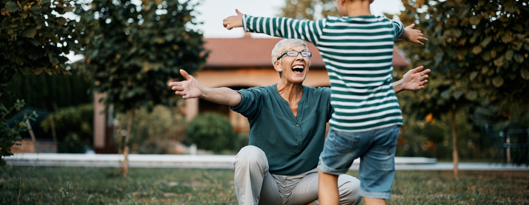 a woman reaching out to a child running towards her