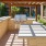 Outdoor lounge at our 55 and over community in Plano, TX, featuring a shade structure and grill stations.