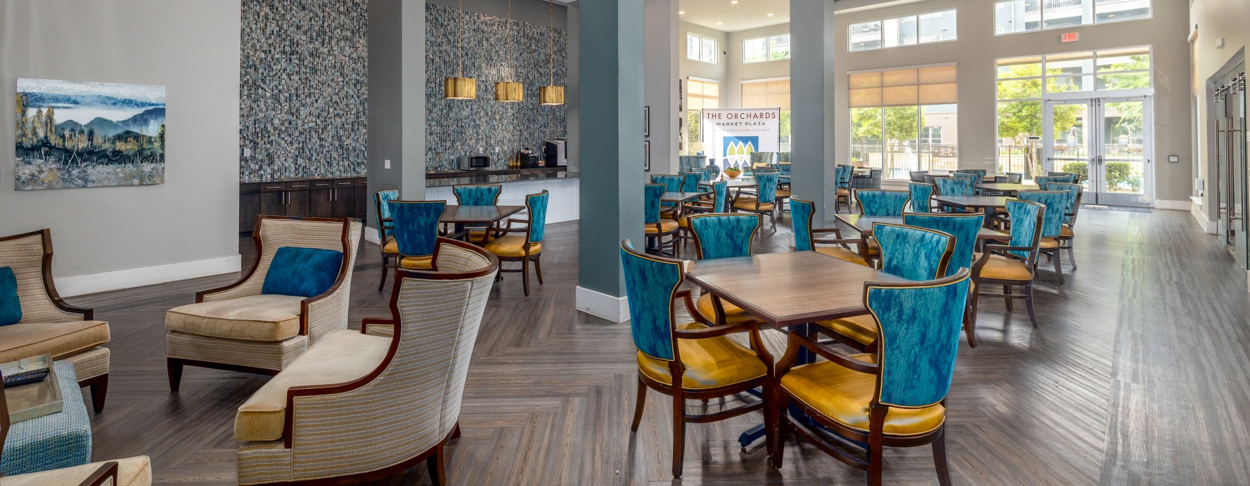 a large area with tall ceilings and chairs to sit in groups