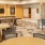 The game and entertainment room at our senior living community in Plano, TX, featuring table games and a shuffleboard table.