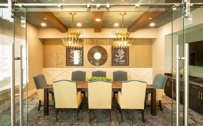 Meeting room at our senior living community in Plano, TX, featuring carpeted flooring and a conference table.